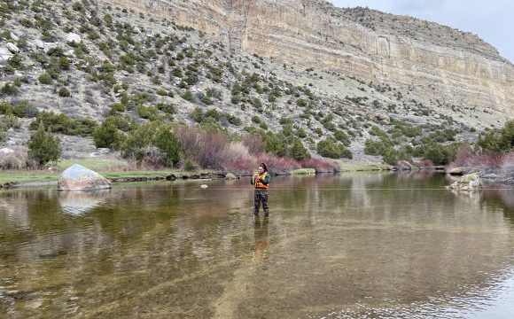 Photo of person fishing in river