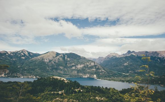 Photo of mountains surrounded by lake