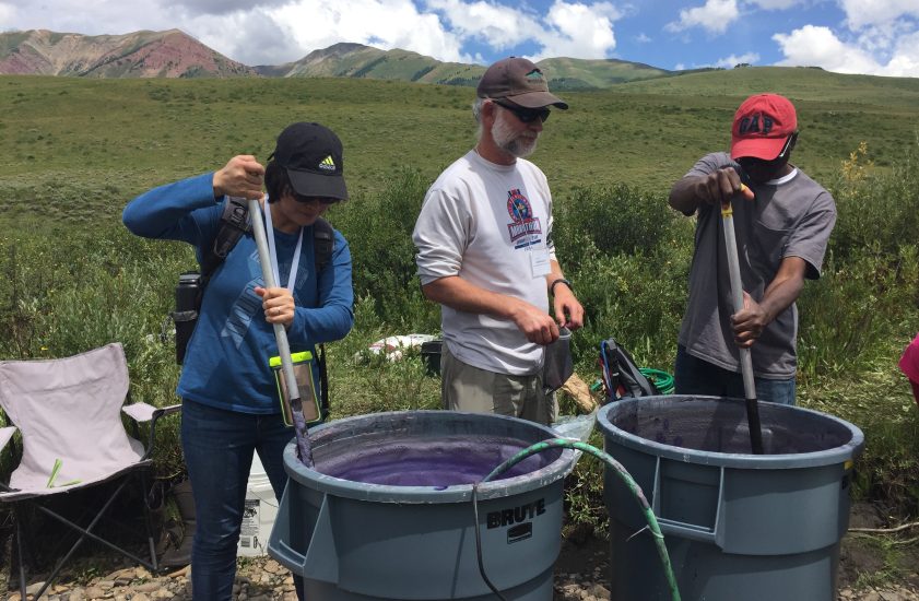 Photo of scientists working in the mountains