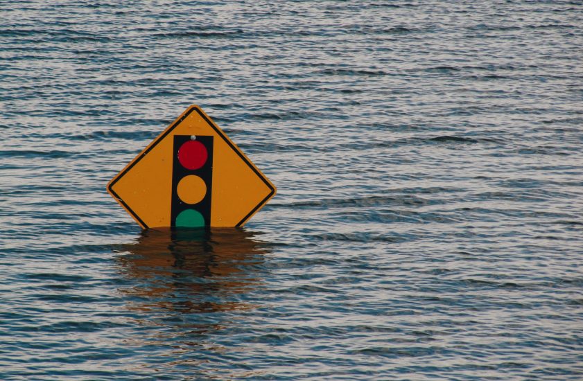 Photo of road signs sticking out of flood waters