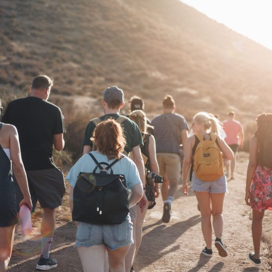 Photo of students walking in the mountains