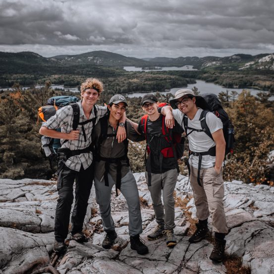 Photo of smiling group on a summit